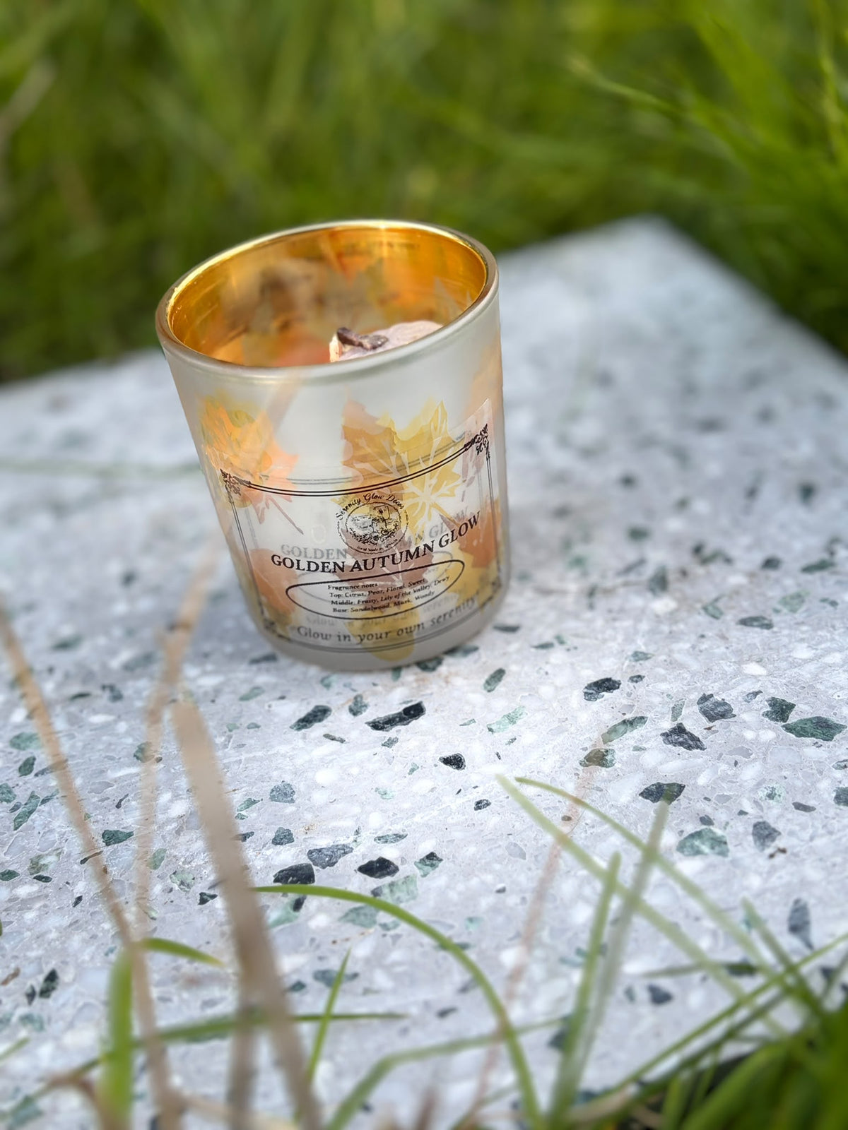 Golden Autumn Glow candle in golden-toned glass